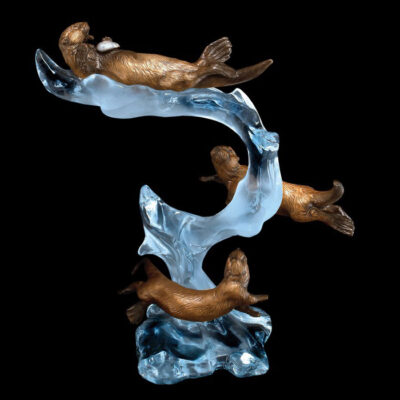 Playful Motion - Otter Sculpture. Artist: Kitty Cantrell. Medium: Bronze, Pewter, Lucite.